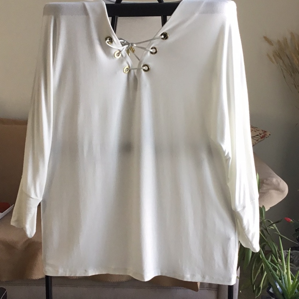 Woman’s Calvin Klein top. It is sz S. It is lightweight and sheer.